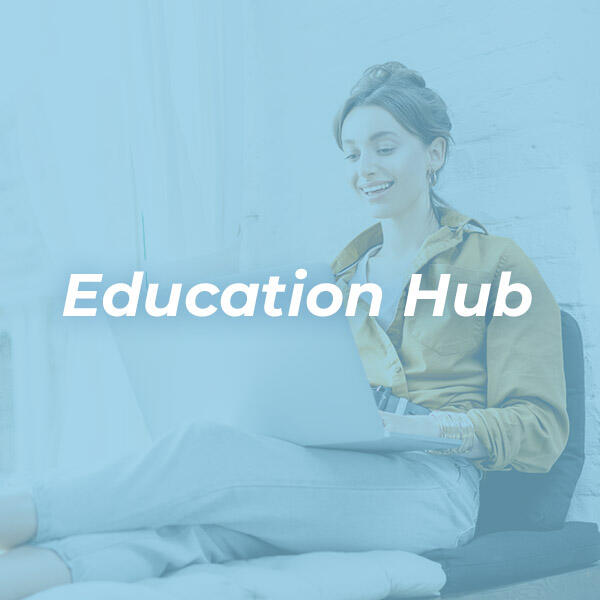 Education Hub image with lady on laptop with blue overlay HVAC Solutions